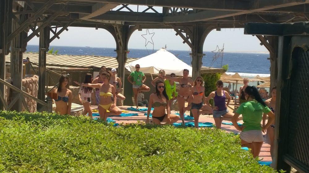 Charmillion Gardens Aquapark Hotel Шарм ел-Шейх Екстериор снимка A yoga class at a resort in Crete, Greece